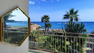 a balcony with a view of the ocean at Cuore di Ognina - Appartamenti vista mare in Ognina