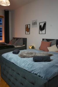 a bedroom with two beds with blankets on them at City Nook Apartments Near Hauptbahnhof in Vienna