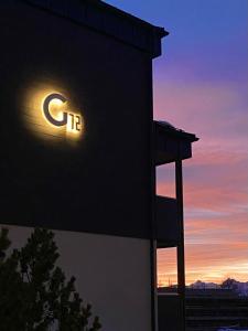 a lit up ct sign on the side of a building at La finestra sulla montagna - The window on the Mountain in Pila