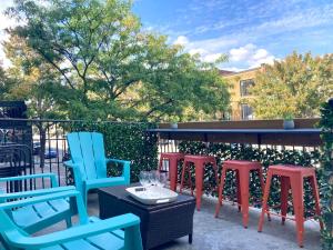 a group of chairs and a table with wine glasses at MTLVacationRentals - The City Chalet in Montréal