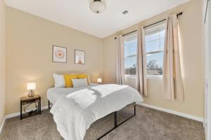 a bedroom with a bed and a window at Hot Tub FirePit Patio Walk To MidTown Downtown in Reno