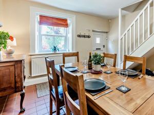 a dining room with a wooden table and chairs at 3 Bed in Baslow PK908 in Baslow