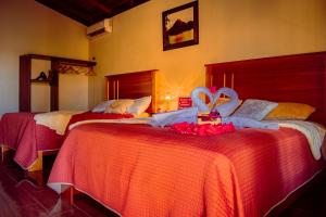 Postel nebo postele na pokoji v ubytování Arenal Descanso