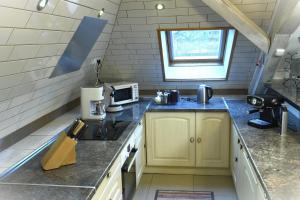 Kuchyň nebo kuchyňský kout v ubytování DUPLEX SPACIEUX TOUT CONFORT + 11 fotografií
