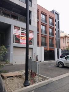 a street light in a parking lot next to a building at New Saburtalo Star in Tbilisi City