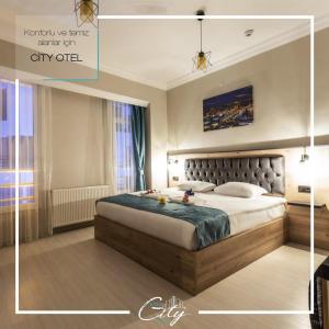 Кровать или кровати в номере Bolu Deluxe Otel
