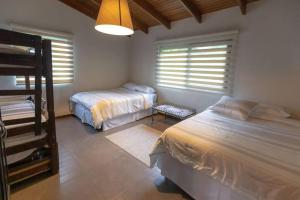 Cama o camas de una habitación en Casa Panimul, Atitlán Lake