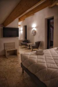 a bedroom with a bed and a living room at A PIANARELLA in San-Gavino-di-Carbini