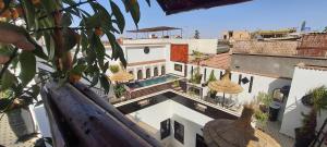 an aerial view of a building with a swimming pool at Dar Najat in Marrakech