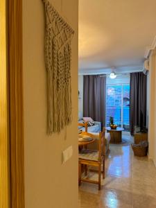 a living room with a table and a room with a living room at Sol de mar, La Mata (Hiszpania) in La Mata +81 photos