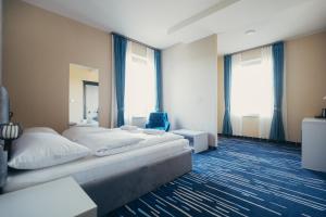 Ein Bett oder Betten in einem Zimmer der Unterkunft Wellness Spa Hotel Jola