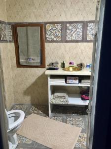 a bathroom with a sink and a toilet at Casa Azul in Chefchaouene