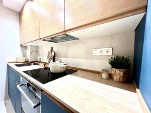 a kitchen with a sink and a counter top at CAMBARAL AS DE GUIA in Luarca
