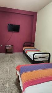 Ένα ή περισσότερα κρεβάτια σε δωμάτιο στο Doña Elena