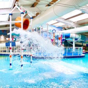 a person playing in a water park at Sunset - A Relaxing Gold 3 bed holiday home at Seal Bay Resort in Chichester +18 photos