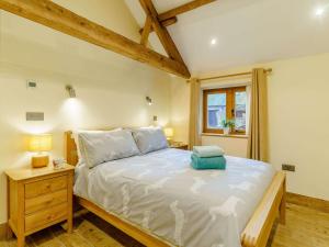 a bedroom with a large bed and a window at 3 bed in Usk 87286 in Llandenny