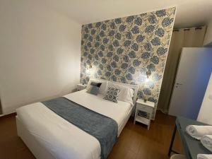 Charming Canonica Apartments tesisinde bir odada yatak veya yataklar