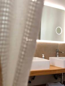 a bathroom with a sink and a mirror at Villa de 4 chambres avec piscine privee terrasse et wifi a Malaucene in Malaucène
