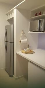 a kitchen with a refrigerator and a plate on a counter at Departamento hermoso en Almagro in Buenos Aires