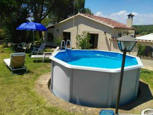 a large hot tub in front of a house at Cosy Chalet in L'Arboçar with Private Pool, 65 sqm in Barcelona +17 photos