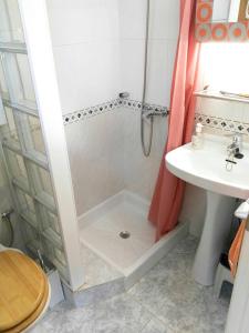 a bathroom with a shower and a sink at Cosy Chalet in L'Arboçar with Private Pool, 65 sqm in Barcelona