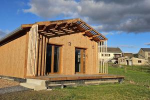 a house being constructed in a field at Chalet Hermillon des Ardennes in Fromelennes +1 photo
