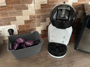 a blender sitting next to a container of purple food at Vaiva’s holiday home in Kaunas