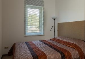 Cama o camas de una habitación en Akva Apartement