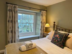 מיטה או מיטות בחדר ב-Croft End Cottage