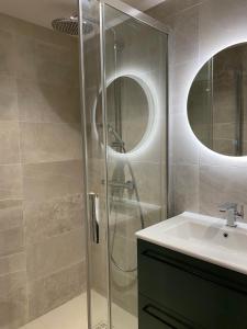 a bathroom with a shower and a sink at L'Appart in La Chapelle-aux-Bois