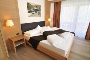 Postel nebo postele na pokoji v ubytování Hotel Chalet Dlaces