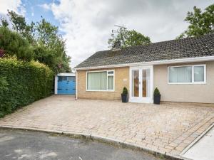 a house with a driveway in front of it at 2 Bed in Cockermouth SZ282 in Cockermouth