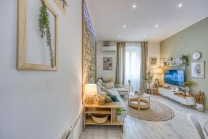 a living room with a couch and a table at Eva - Storia Parentina in Poreč