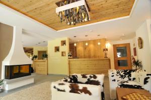 Postel nebo postele na pokoji v ubytování Hotel Chalet Dlaces