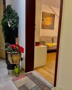 a living room with a vase with flowers in it at Apartment near Central Station in Zurich