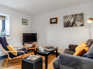 a living room with two couches and a tv at 1 bed in Brecon BN034 in Cray