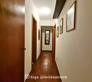 a corridor of a hallway with at Apartamento com vista para o mar in Torres