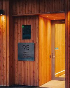 a building with a sign on the side of it at Beautiful urban apartment 4 in Nelson