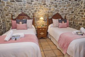 Posteľ alebo postele v izbe v ubytovaní Casa Rural Tia Josefa