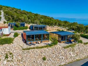 an aerial view of a house on the beach at Luxury Mobile Home Kasthouse Oleander in Mali Lošinj