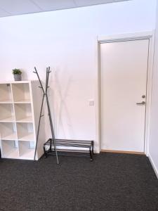 an empty room with a treadmill next to a door at Rentalux Apartments at Vivansborg in Timrå