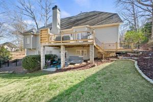a large house with a large deck on top of it at Excellent Roswell Location! in Roswell