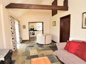 a living room with a couch and a table at 1 bed in Bradford-on-Avon 58771 in Erlestoke