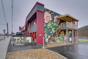 a building with a mural on the side of it at Quaint Kingsport Apartment Near Greenbelt Trail! in Kingsport