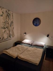 a bedroom with two beds and a window at Camping de Ikeleane in Bakkeveen +46 photos