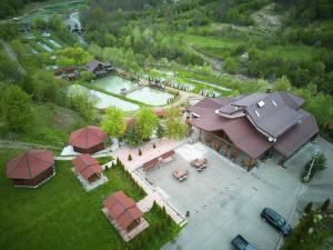 an overhead view of a large building with a pool at Păstrăvăria Crasna Bogiri in Izvoarele