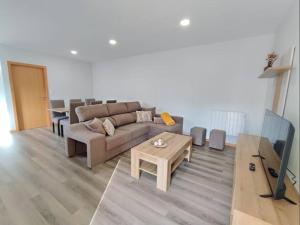 a living room with a couch and a table at Casa Fronteiriça in Valença