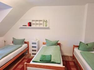 Ένα ή περισσότερα κρεβάτια σε δωμάτιο στο Fremdenzimmer