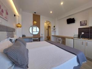 A bed or beds in a room at Sand and Sea