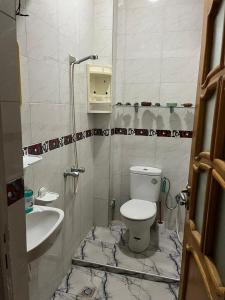 a bathroom with a toilet and a sink at Dar sidi in Rabat